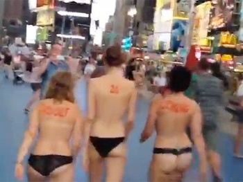Bullet Director Woody Harrelson Parades Topless Women in Times Square to Announce 'Adolf Is Coming!'