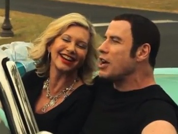 Grease Stars John Travolta & Olivia Newton-John Reunite for Wacky Holiday Music Video