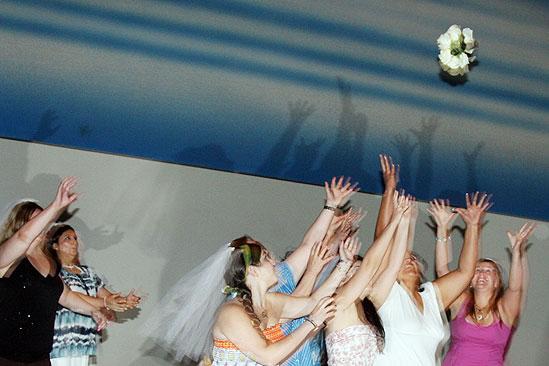 Mamma Mia 15th Longest Running Show - brides catching bouquet