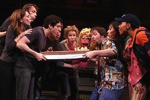 Photo Op - Avenue Q plays 1,500 performance - cast blows out cake candles