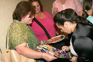 Photo Op - Hairspray sing-a-long launch - Nikki Blonsky (signing poster)