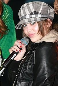 Photo Op - Miley Cyrus at Mamma Mia! - Miley Cyrus (microphone)