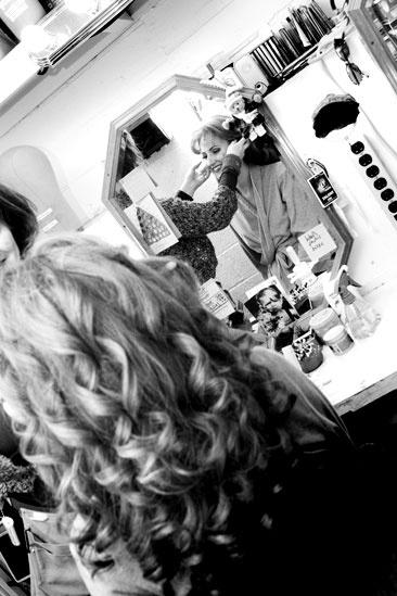 Girls in Jersey Boys – Heather Ferguson in the mirror with long wig