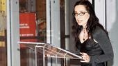 Time to present some awards! Emcee Janeane Garofalo steps up to the podium.