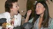 "Even you, Mrs. Brill. Opeeeeeen....!"Ashley Brown gives co-star Jane Carra spoonful of sundae.