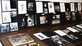 An inspiration board includes costume sketches, relevant books and personal photos.