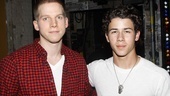 Sporting some dog tag-esque neckwear, Nick Jonas reports for photo duty alongside American Idiot’s resident soldier, Stark Sands.