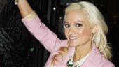 Holly Madison makes her mark on the show's backstage autograph wall. 