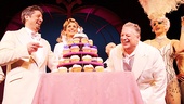 Christopher Sieber and Harvey Fierstein are presented a tower of festive cupcakes in honor of La Cage's one year anniversary. 