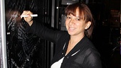 Maya Rudolph signs the autograph wall backstage at Mary Poppins.