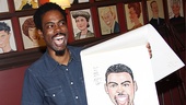 Ever the comedian, Chris Rock signs his Sardi's portrait, 