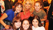Look at those happy faces! Kristin Chenoweth pauses to greet young admirers from the Broadway Dreams Foundation. 
