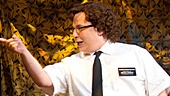 Jared Gertner as Elder Cunningham and the national tour cast in The Book of Mormon.