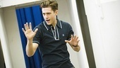 Aaron Tveit gets into character with a little song and dance.