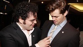 Josh Gad adjusts his Mormon co-star and fellow nominee Andrew Rannell's tie. 