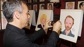  Joe Mantello snaps a shot of pal John Benjamin Hickey’s caricature for his personal collection. 