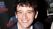 Michael Urie flashes a big smile while signing autographs at Planet Hollywood.