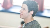 Nick Jonas observes the General D. “Chappie” James Middle School students in action.