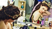 The actress adjusts her wig and makes sure her first costume is in place.