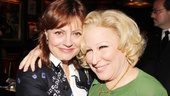 Susan Sarandon and Bette Midler share a hug at the opening night party.