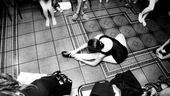 Billy Elliot Ballet Girls Open Call – b&w girl stretching on a tile floor