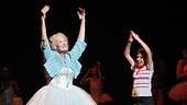 Grandma, played by Katherine McGrath, takes a bow and gets a hand from her on stage grandson, Tade Biesinger. 