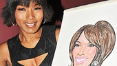 Angela Bassett contemplates changing her hair color so she looks even more like her cute caricature after signing. 