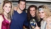 Rock of Ages headliners Ashley Spencer, Justin Matthew Sargent and Jeremy Woodard form a huddle around Tim Tebow. 
