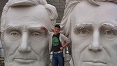 While exploring Houston, Mark David Kaplan finds himself sandwiched between enormous busts of U.S. Presidents Abraham Lincoln and Andrew Jackson at Adickes SculturWorx Studio.