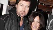 Victor's Cafe manager Monica Zaldivar congratulates Billy Ray Cyrus on his opening night. 