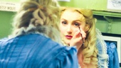 Now in full Rosa Bud couture, Betsy Wolfe puts the finishing touches on her makeup.