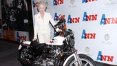 Taylor poses with Ann Richards’ specially made Texas motorcycle. 