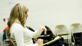 Jessica Hartman delivers some congratulatory remarks along with constructive criticisms.