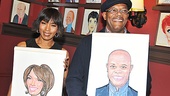 Double trouble! Angela Bassett and Samuel L. Jackson proudly flaunt their brand new caricatures.